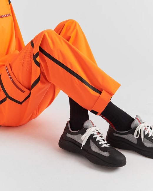 Pantaloni In Extreme Tex Light di Prada in Orange da Uomo