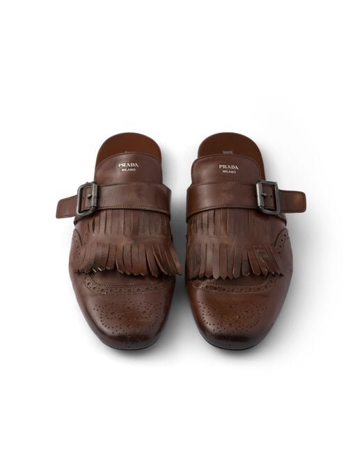 Prada Brown Shuffle Antiqued Leather Mules With Buckled Strap And Fringe for men