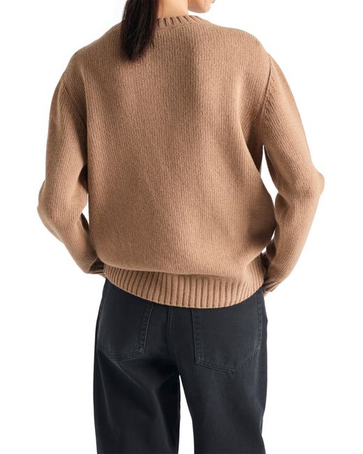 Pull à logo intarsia Prada en coloris Natural