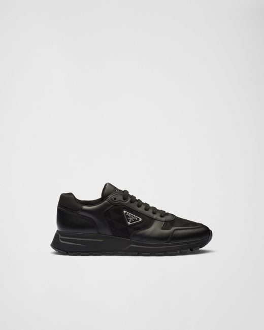 Prada Re Nylon Brand Plaque Leather And Recycled Nylon High Top Trainers in Black for Men Lyst UK