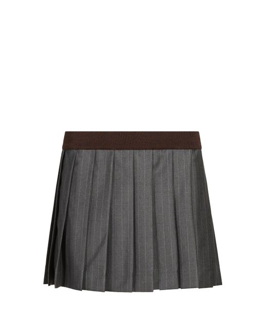 Jupe courte plissée Miu Miu en coloris Black