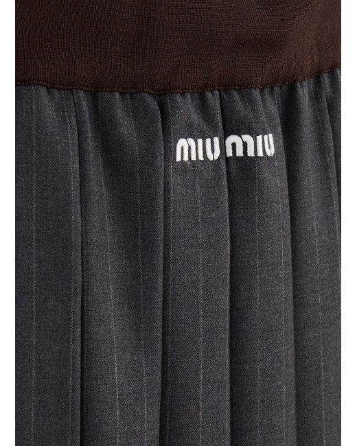 Jupe courte plissée Miu Miu en coloris Black