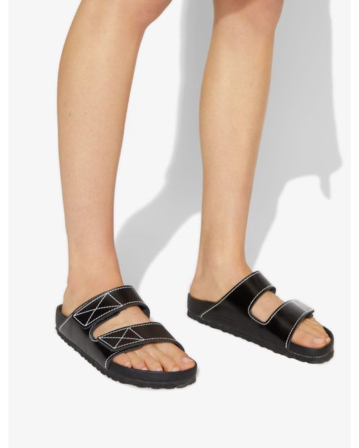 Proenza Schouler Birkenstock Arizona Topstitched Glossed-leather Sandals in  Black - Save 50% - Lyst