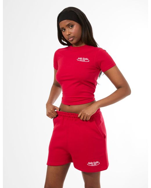 Public Desire Kaiia Running Club Logo Longline Baby Tee Red