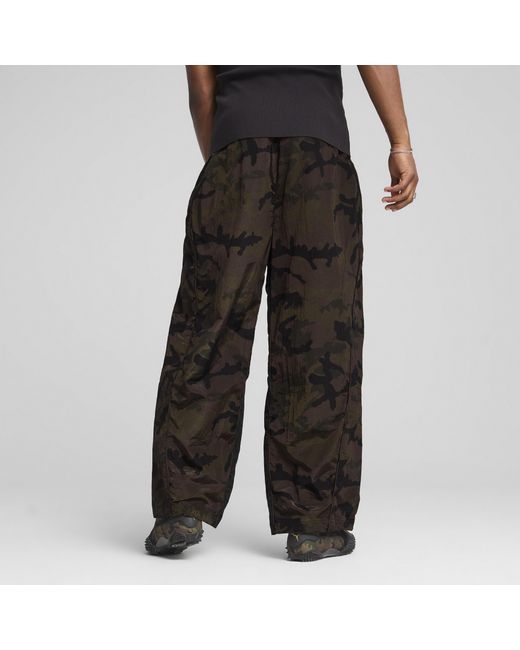 PUMA Mostroverse Clrt Uniseks Ripstopbroek Met All-Over-Print Voor in het Black