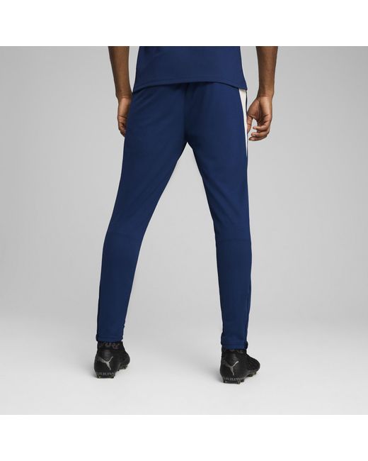 PUMA Portugal Trainingsbroek, Blauw/Rood/Bruin in het Blue