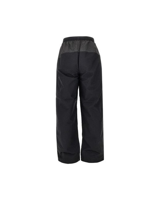 Umbro Black Rose Crest Nylon Track Pants for men