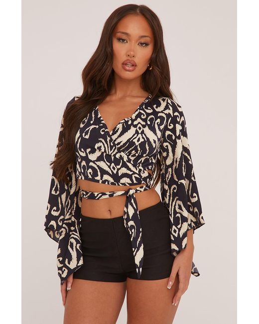 Rebellious Fashion Black Abstract Print Wrap Over Cropped Top