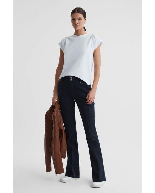 PAIGE cotton-blend Flared Trousers - Farfetch