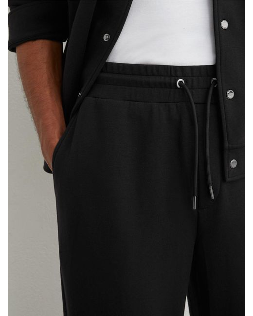 Reiss Black Sueded Interlock Jersey Relaxed-Fit Joggers for men