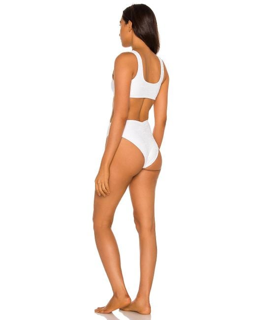 https://cdna.lystit.com/520/650/n/photos/revolveclothing/6a0ad9cf/montce-swim-White-Ky-One-Piece-Bikini.jpeg