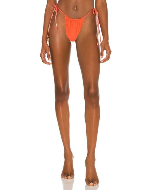 Luli Fama Seamless String Brazilian Tie Side Bikini Bottom in Ruby (Brown)  - Save 28% - Lyst