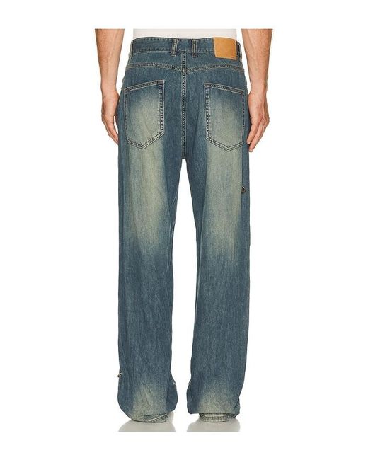 we11done Blue Piercing Denim Jeans for men
