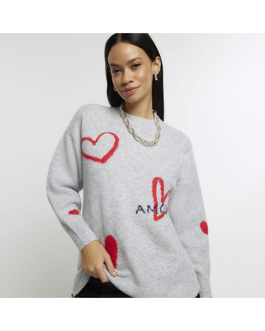 White jumper with shop red hearts