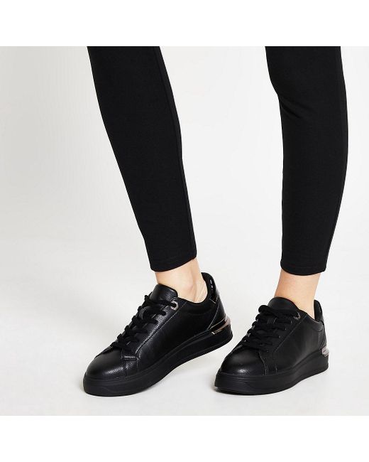 black faux leather trainers