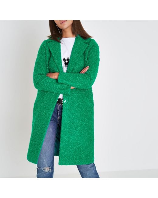 Green boucle shop coat