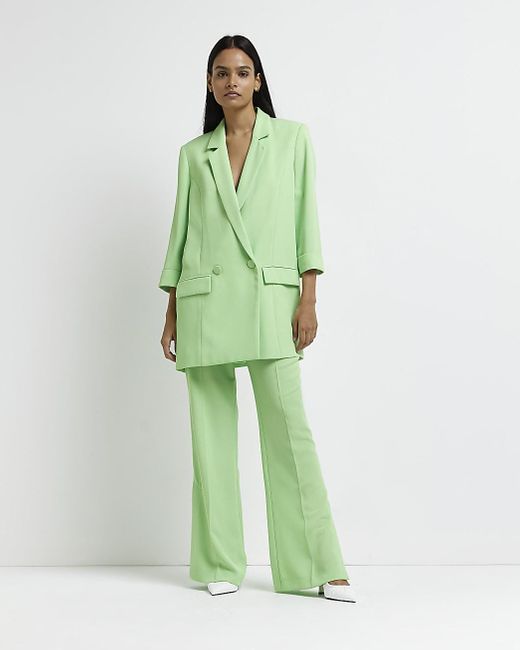 Green Split Hem Flared Trousers | Lyst 