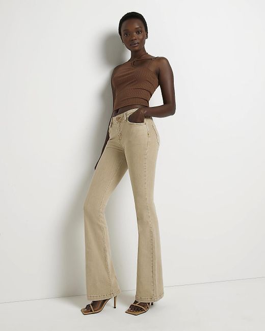 River Island Mid Rise Flare Jeans in Natural | Lyst