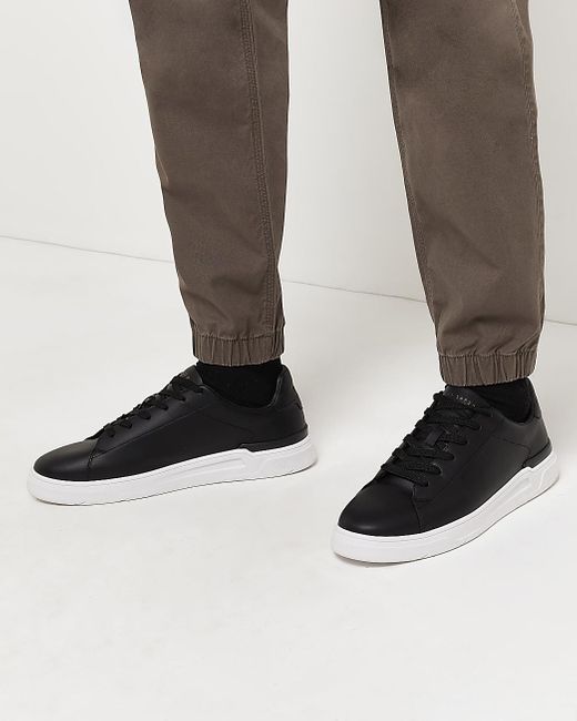 black cupsole trainers