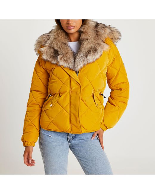yellow quilted coat