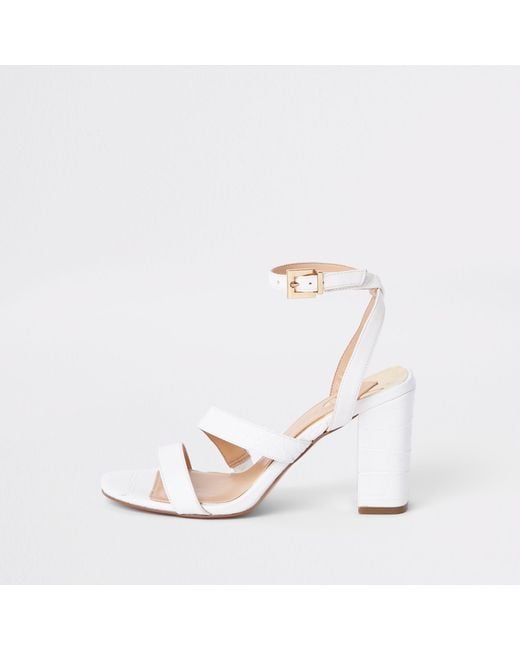 Asymmetrical strappy cheap block heels