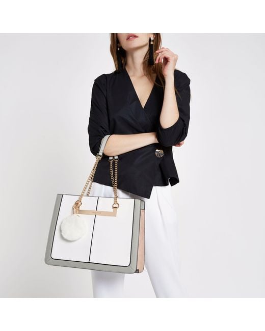 River island black chain handle pom pom tote bag sale