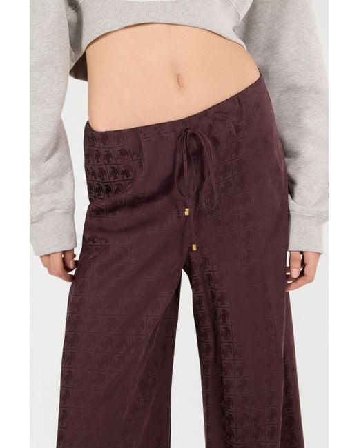 Pantaloni Loose Con Monogram Mirror Snake di Roberto Cavalli in Purple