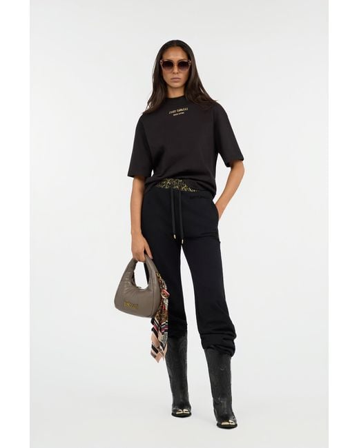Roberto Cavalli Black Flared Trousers With Leopard Print Waistband