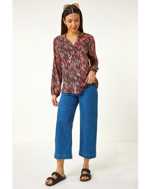 Roman Orange Aztec Print V-Neck Top