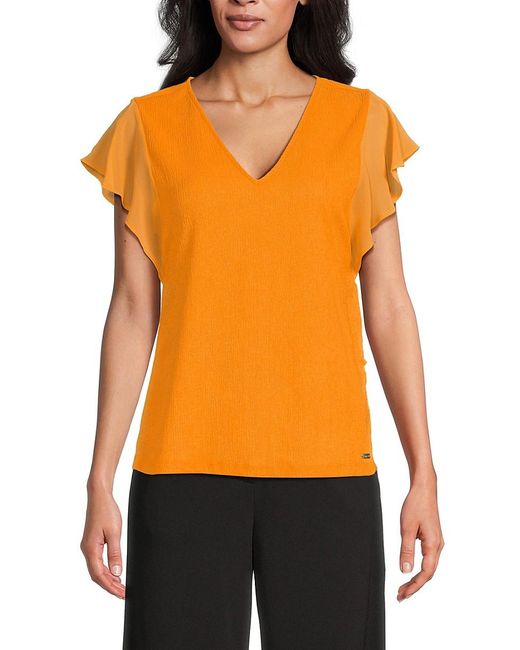 Calvin Klein Textured V Neck Blouse in Orange Lyst UK