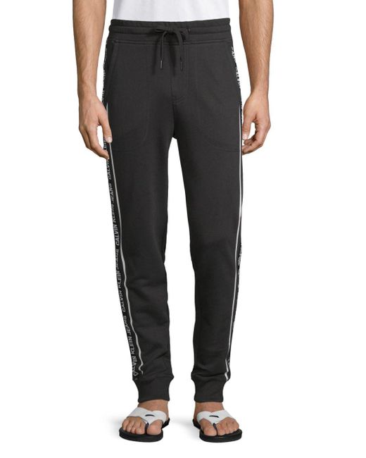 Calvin Klein Logo Tape Cotton Jogger Pants in Black for Men | Lyst | Stoffhosen