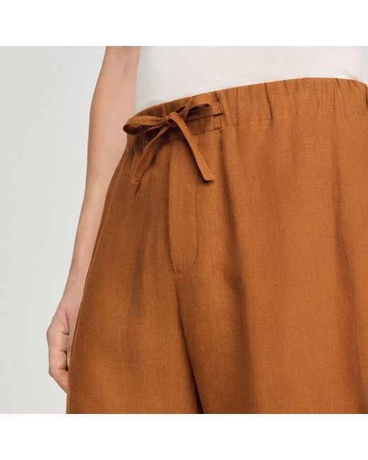 Sandro Orange Elastic Waist Linen Shorts for men