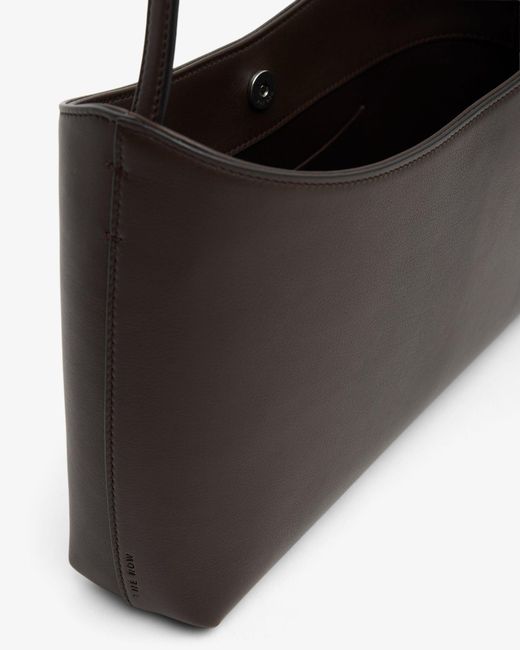 The Row Black Alma Baguette Dark Shoulder Bag