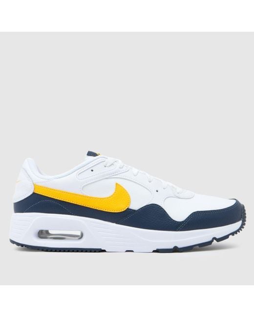 nike trainers blue with yellow tick