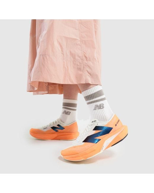 New Balance Orange Fuelcell Rebel V4 Trainers