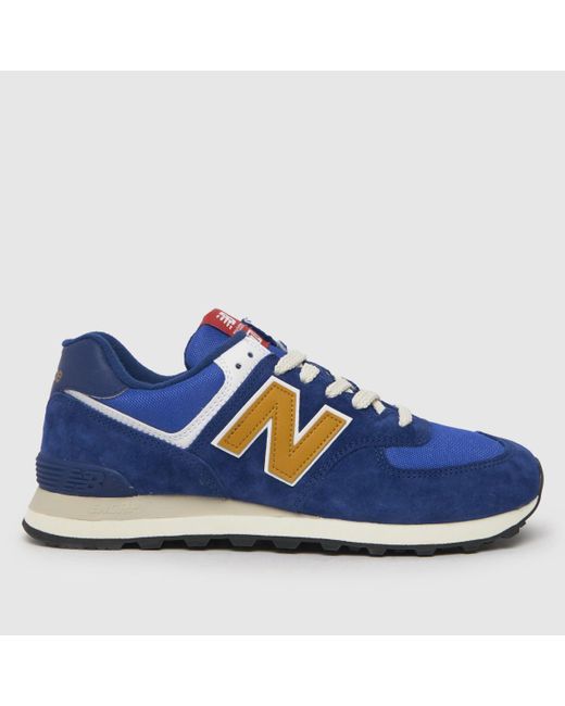 New Balance Blue 574 Trainers In Navy & Gold for men