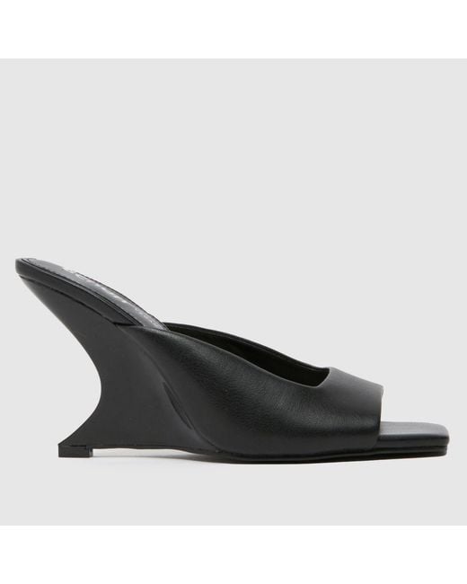 Schuh Black Stormi Wedge Mule High Heels