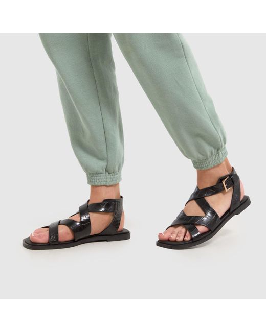 Schuh Black Tide Croc Flat Sandals In