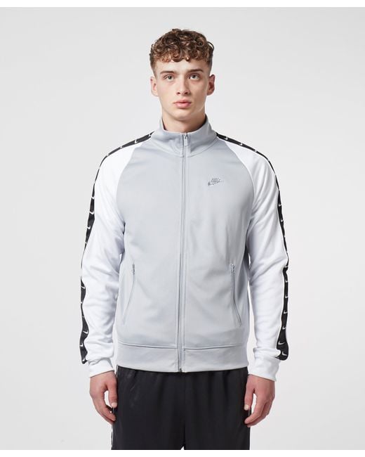 nike tape track top