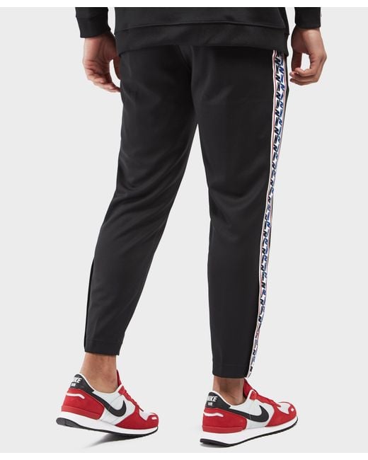 Nike Synthetic Taped Poly Track Pants in Black for Men | Lyst Canada