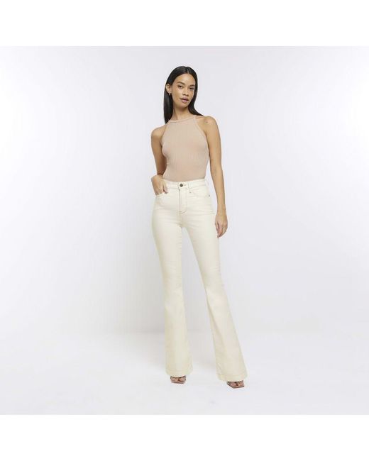River Island Flared Jeans Cream Ecru Tummy Hold Cotton in White | Lyst UK