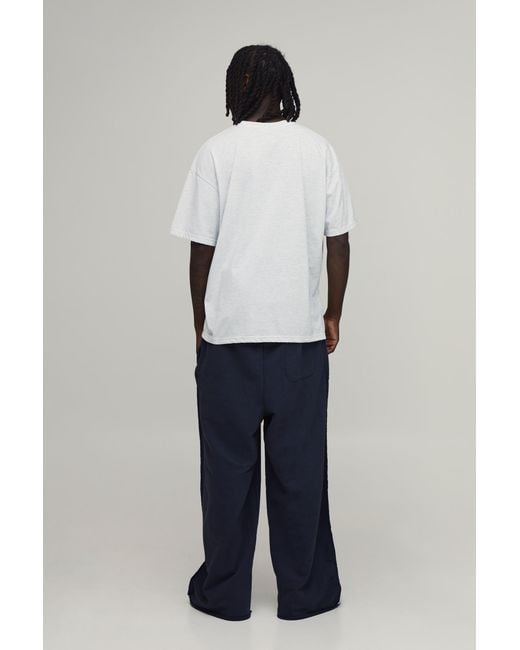 BoohooMAN Blue Extreme Wide Leg Loopback Embroidered Raw Hem Joggers for men