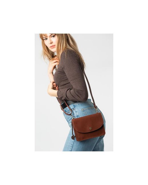 Conkca Brown 'Cara' Conker Leather Cross Body Clutch Bag