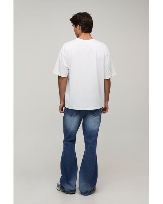 BoohooMAN Blue Crease Wash Ripped Knee Flared Jeans for men