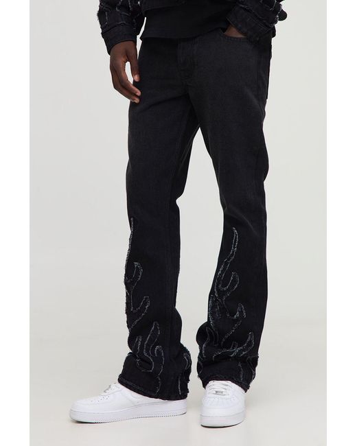 BoohooMAN Black Flame Applique Stacked Slim Fit Flared Jeans for men