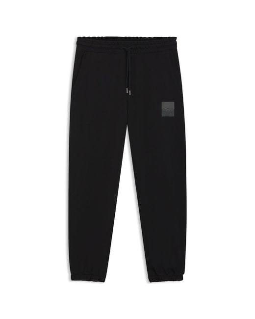 HUGO Black Cotton-Terry Tracksuit Bottoms With Split Logo for men