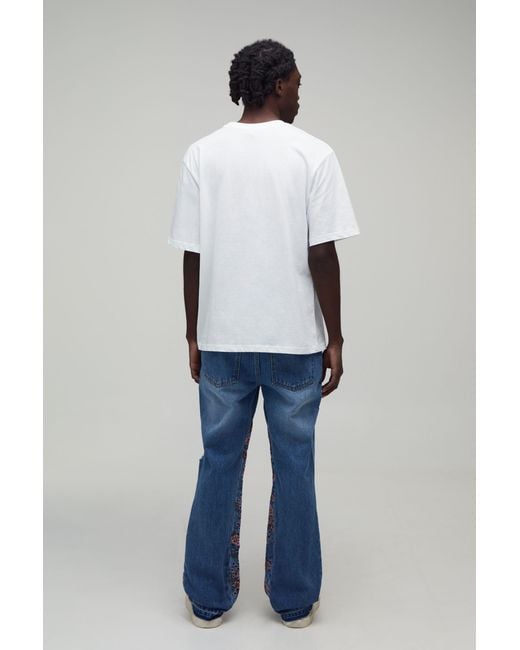 BoohooMAN Blue Floral Gusset Ripped Knee Slim Flared Jeans for men