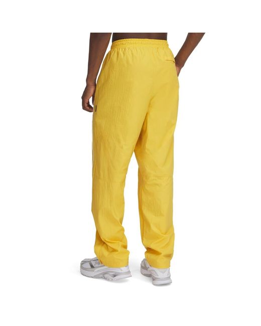 Under Armour Yellow Solid Patterned Track Pants for men