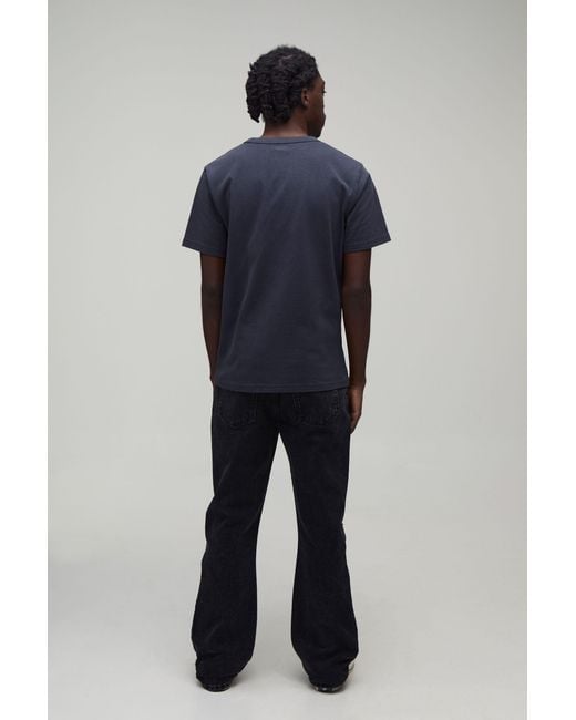 BoohooMAN Black All Over Ripped Stacked Gusset Slim Flared Jeans for men