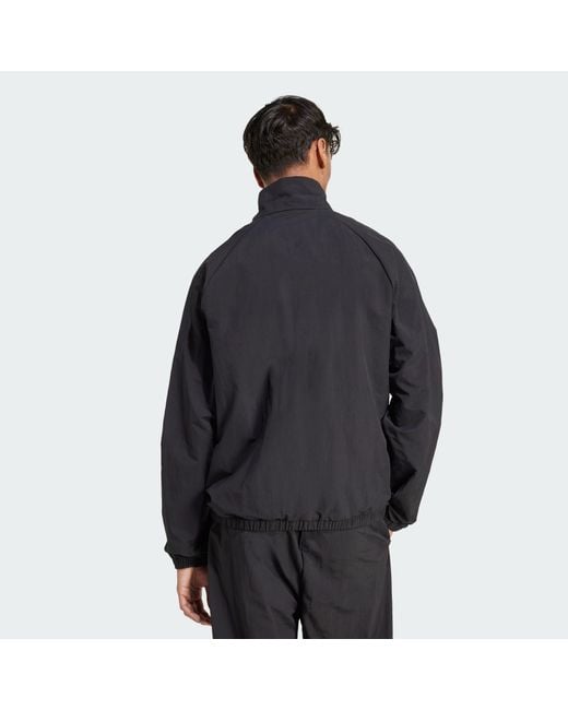 Adidas Black Essential Small Logo Windbreaker for men